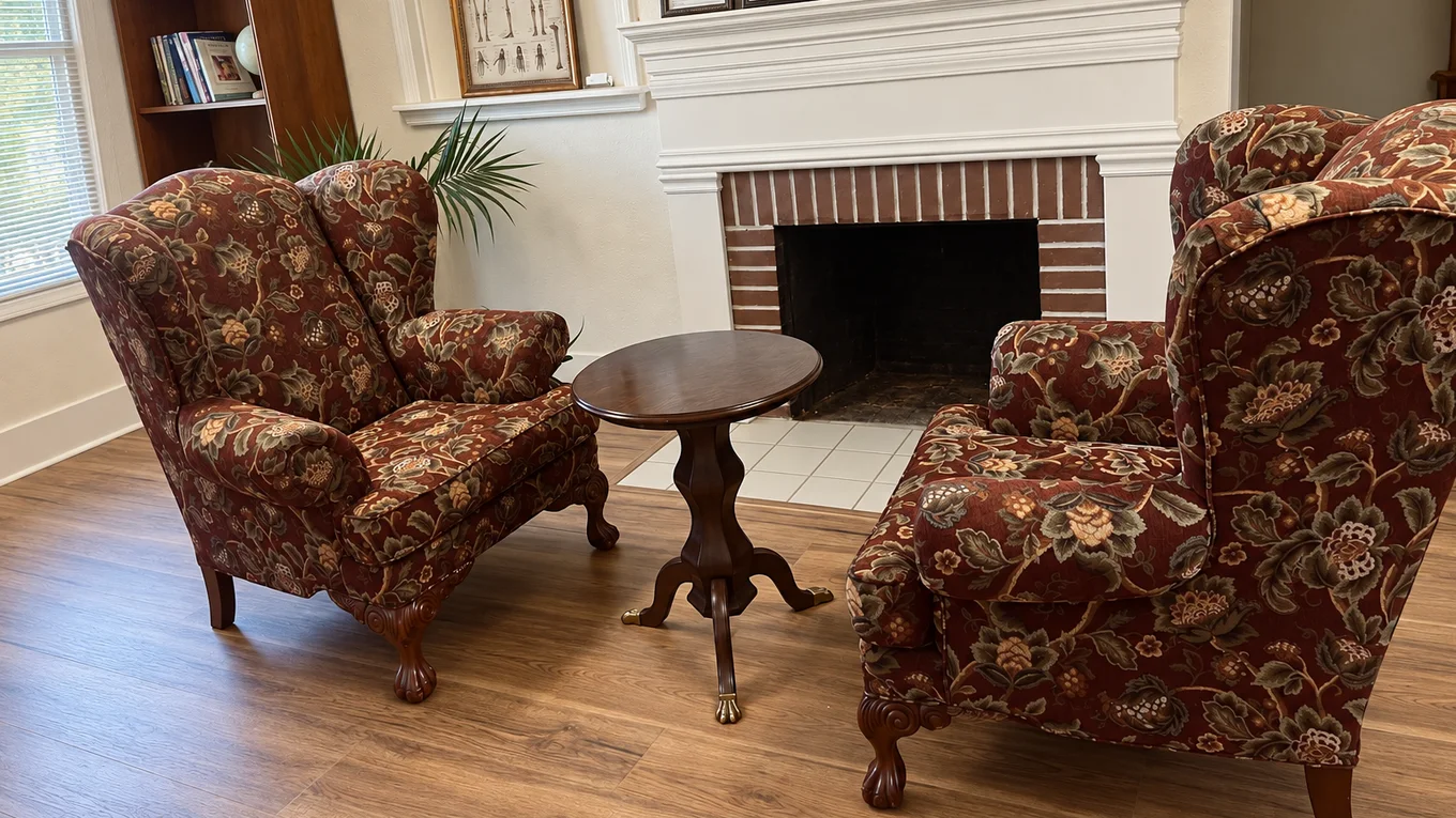 Two armchairs and a fireplace in Resolution Health's waiting room